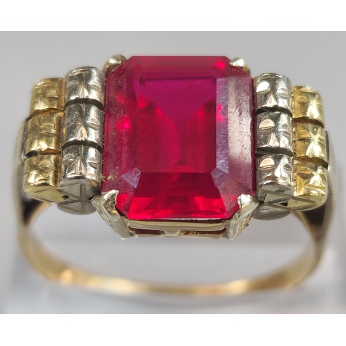 215 - 9ct gold red stone dress ring. 5.7g approx. Size S1/2. (B.P. 21% + VAT)