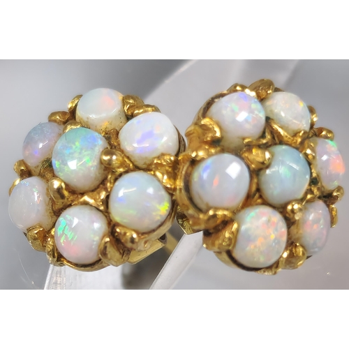 226 - Two similar pairs of opal cluster earrings, one marked 9ct gold the other RG. (B.P. 21% + VAT)