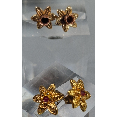 229 - Pair of 9ct gold Daffodil earrings. 1.5g approx. Together with another pair of gold plated flowerhea... 