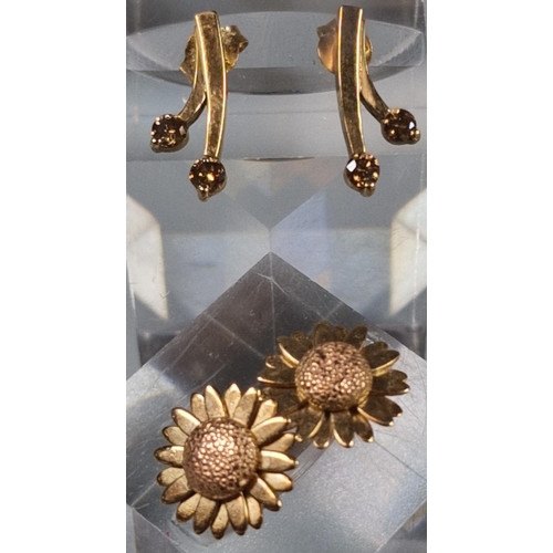 231 - Pair of 9ct gold sunflower earrings, together with a pair of 9ct and brown stone earrings. 4.5g appr... 