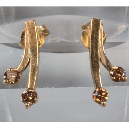 231 - Pair of 9ct gold sunflower earrings, together with a pair of 9ct and brown stone earrings. 4.5g appr... 