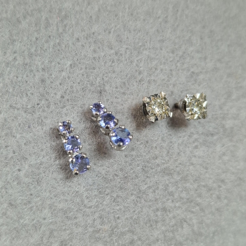 232 - Pair of 18ct white gold diamond earrings. 1.3g approx. Together with a pair of 10K white gold and pu... 