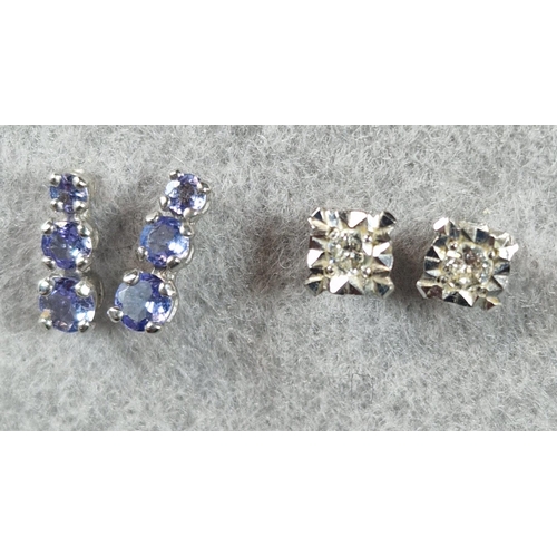 232 - Pair of 18ct white gold diamond earrings. 1.3g approx. Together with a pair of 10K white gold and pu... 