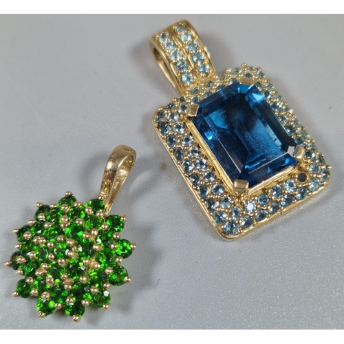 233 - Two 9ct gold pendants inset with blue, clear and green cluster stones. 9.3g approx. (B.P. 21% + VAT)