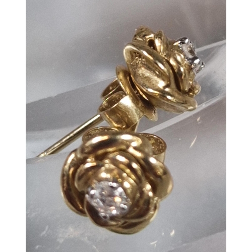 236 - Three pairs of 9ct gold earrings of flowerhead and rose form inset with tiny diamonds. 4.9g approx. ... 