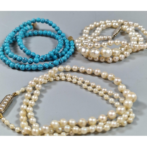 244 - Two graduated pearl necklaces, one with white metal and diamond clasp, the other yellow metal clasp.... 