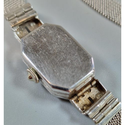 255 - 9ct white gold and diamond Art Deco ladies' wristwatch, with 9ct white gold mesh strap. 19g approx. ... 