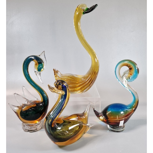 26 - Three multi coloured Art Glass stylised Swan figures, together with a stylised Duck. (4) (B.P. 21% +... 