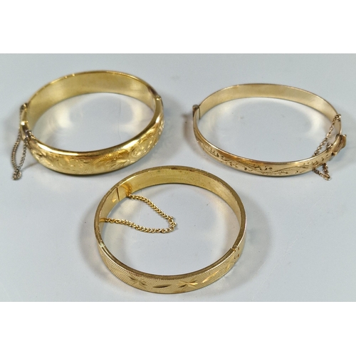 262 - Three rolled gold ladies bangles. (B.P. 21% + VAT)