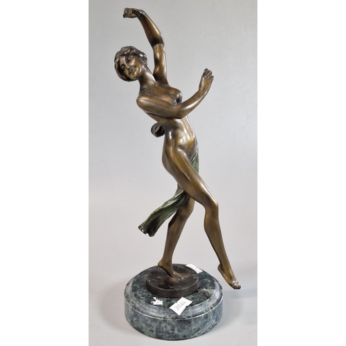 31 - After Chiparus, patinated bronze Art Deco style figure of a nude dancing woman on circular marble ba... 