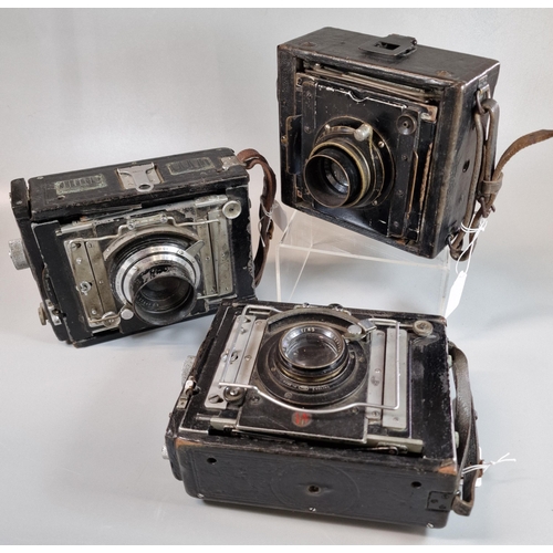 33 - Three vintage bellows plate cameras, with Ross and Dallmeyer lenses. (3)  (B.P. 21% + VAT)