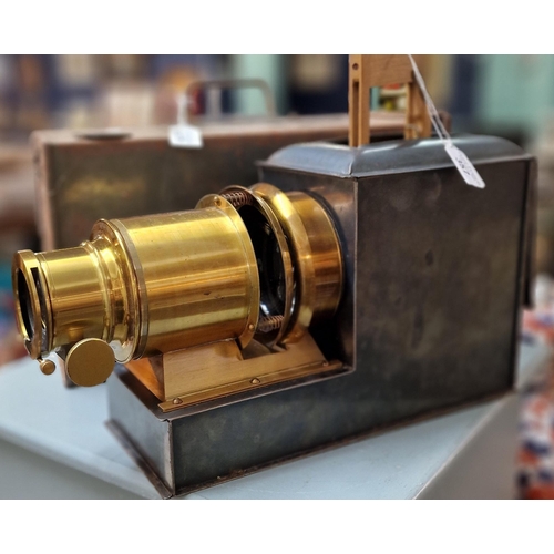 357 - 19th century Magic Lantern projector with gilt brass lens, oxidised metal body and original metal ca... 