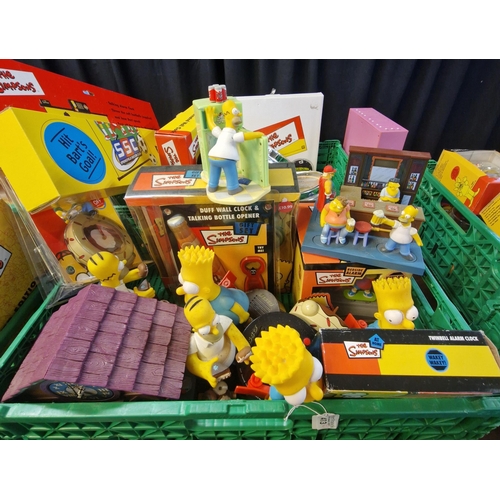 413 - Two boxes of assorted The Simpsons items to include: Topper alarm clock, Bart and Homer Simpsons ala... 