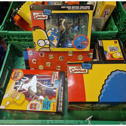 414 - Two boxes of The Simpsons items to include: ceramic money bank, limited edition collector's plates s... 