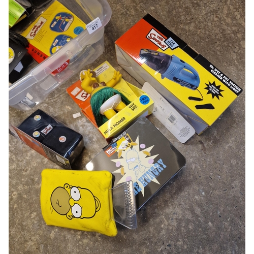 417 - Plastic box of The Simpsons Car Care items to include: car care kit, Hula Homer, wet and dry vacuum ... 