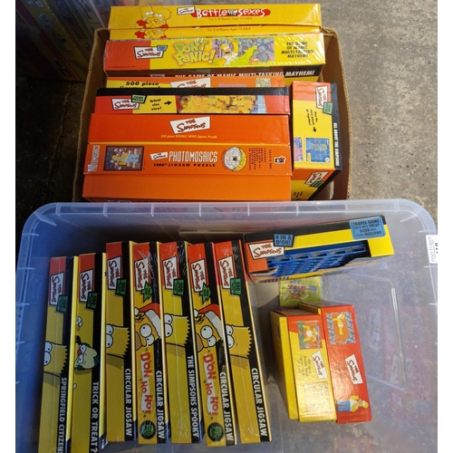 418 - Four boxes of The Simpsons jigsaws and board games to include: Monopoly, circular jigsaws, Battle of... 