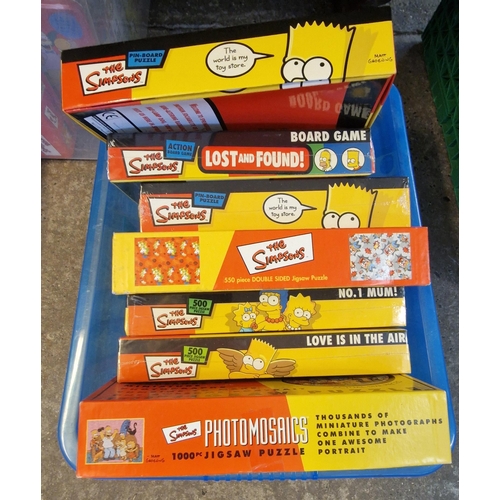 418 - Four boxes of The Simpsons jigsaws and board games to include: Monopoly, circular jigsaws, Battle of... 