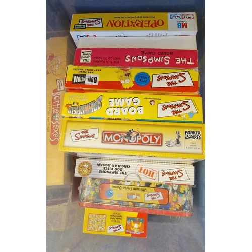 418 - Four boxes of The Simpsons jigsaws and board games to include: Monopoly, circular jigsaws, Battle of... 