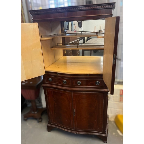 433 - Reproduction mahogany serpentine cocktail cabinet. 81x46x157cm approx.  (B.P. 21% + VAT)