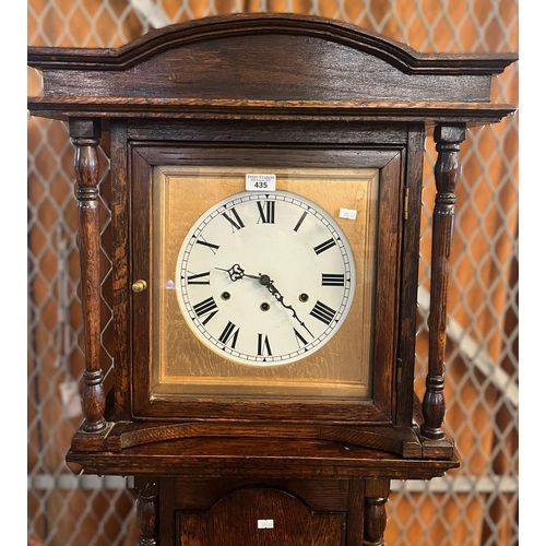 435 - 18th century style oak long case clock, with three train movement and painted Roman face. 20th centu... 