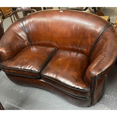 457 - Art Deco style tan leather kidney shaped three piece suite comprising: two seater sofa and pair of a... 