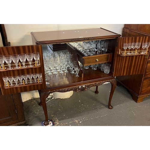 477 - Reproduction mahogany blind panelled cocktail cabinet, the interior revealing various drinking glass... 