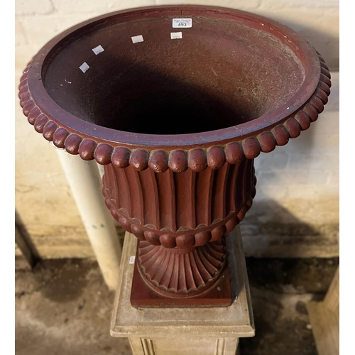 493 - Pair of cast iron fluted campana shaped pedestal vases standing on ceramic square section panel desi... 