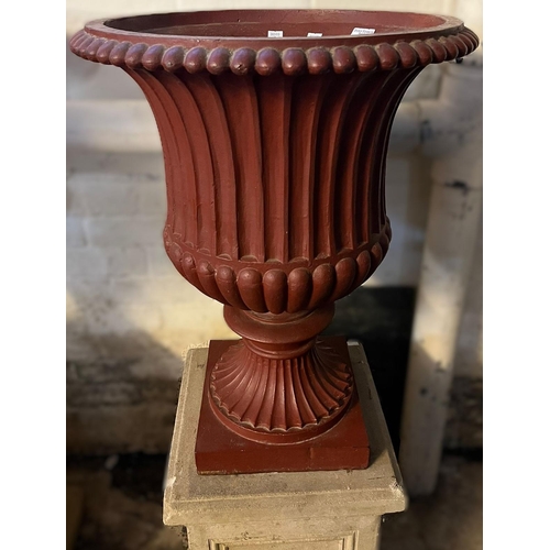 493 - Pair of cast iron fluted campana shaped pedestal vases standing on ceramic square section panel desi... 