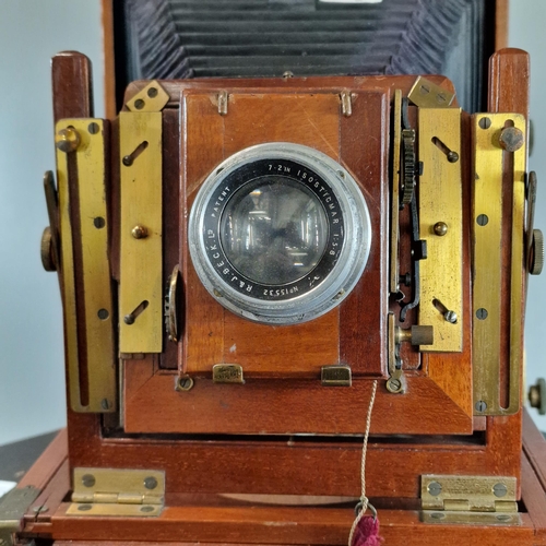 53 - Thornton Pickard mahogany plate camera. with R & J Beck lens, together with a further gilt brass len... 