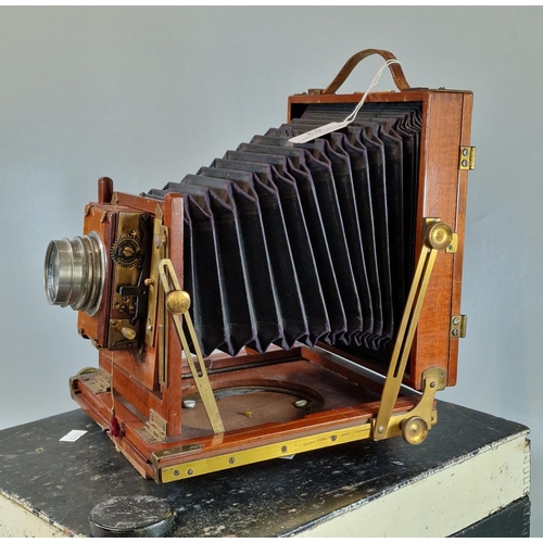 53 - Thornton Pickard mahogany plate camera. with R & J Beck lens, together with a further gilt brass len... 