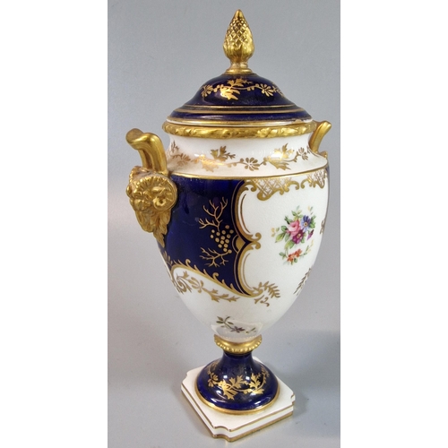 7 - Coalport Porcelain twin handled urn shaped vase and cover, on a white and cobalt ground with gilded ... 