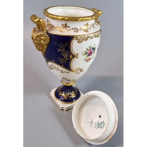 7 - Coalport Porcelain twin handled urn shaped vase and cover, on a white and cobalt ground with gilded ... 