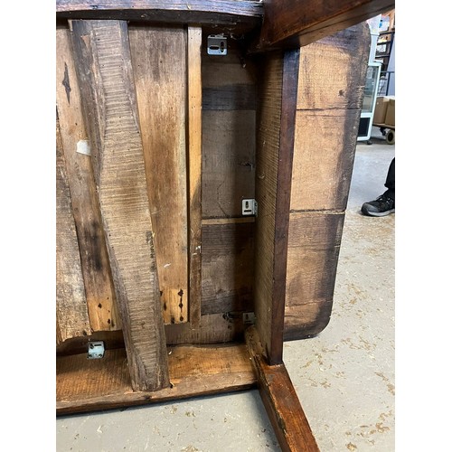 443 - 19th century elm farmhouse table, the moulded and shaped top above three drawers with turned handles... 