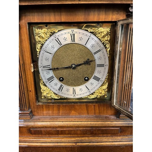 91 - Early 20th century German walnut cased architectural mantel clock with brass face, having Roman silv... 