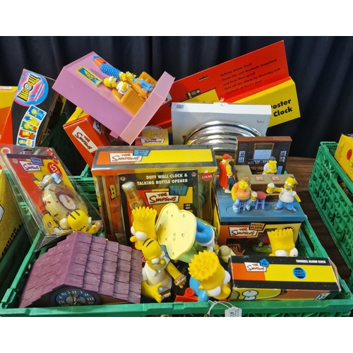 378 - Two boxes of assorted The Simpsons items to include: Topper alarm clock, Bart and Homer Simpsons ala... 