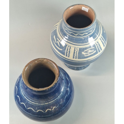 17 - Two Ewenny Clay Pits Pottery vases of baluster form on blue grounds with stylised decoration, and an... 