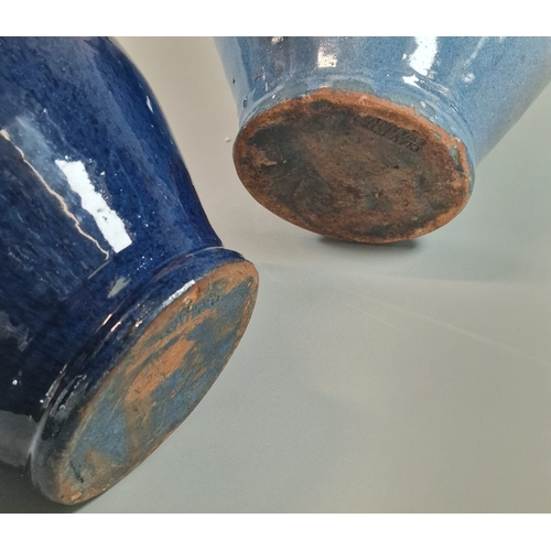 17 - Two Ewenny Clay Pits Pottery vases of baluster form on blue grounds with stylised decoration, and an... 