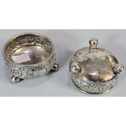 179 - Pair of Victorian repoussé salts on ball feet. 3.5 troy oz approx. Together with two silver napkin r... 