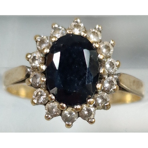 187 - 9ct gold cubic zirconia and blue cluster dress ring. 2g approx. Size N. (B.P. 21% + VAT)