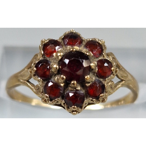 196 - 9ct gold garnet cluster flowerhead ring. 2.1g approx. Size O. (B.P. 21% + VAT)