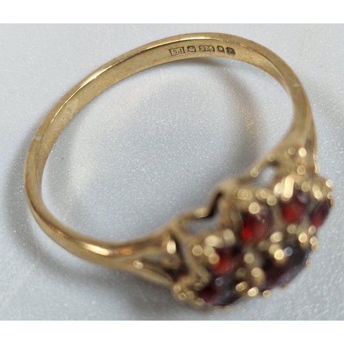 196 - 9ct gold garnet cluster flowerhead ring. 2.1g approx. Size O. (B.P. 21% + VAT)