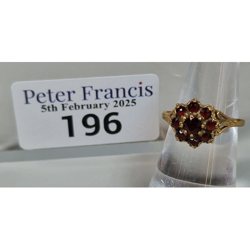 196 - 9ct gold garnet cluster flowerhead ring. 2.1g approx. Size O. (B.P. 21% + VAT)