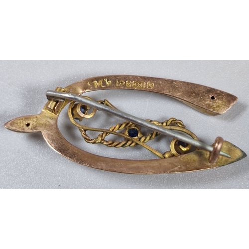 208 - 9ct gold wishbone brooch with three inset blue stones. 2.7g approx. (B.P. 21% + VAT)