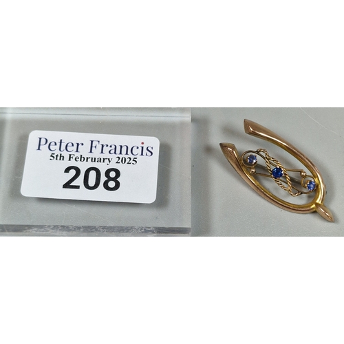 208 - 9ct gold wishbone brooch with three inset blue stones. 2.7g approx. (B.P. 21% + VAT)