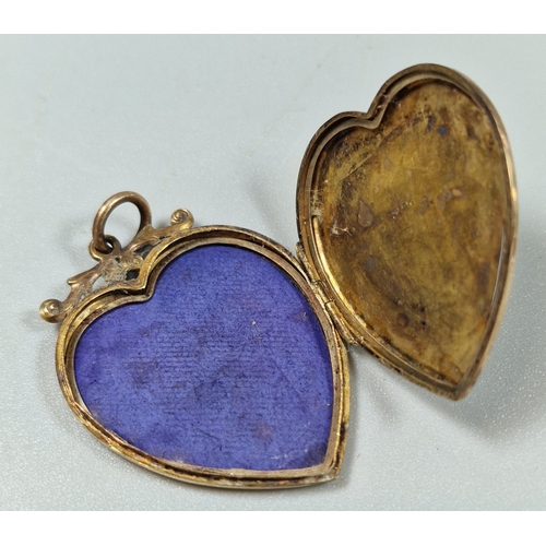 213 - 9ct gold engraved heart shaped locket pendant. 3.9g approx. Together with a dress ring and petal cur... 