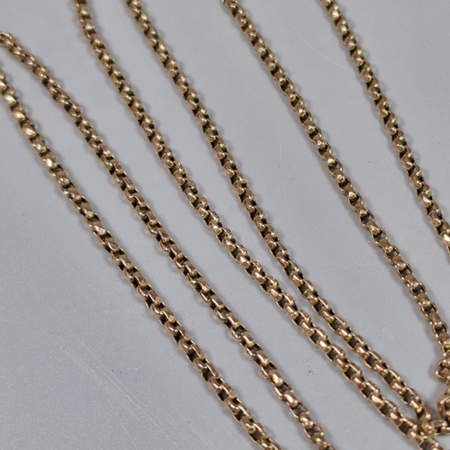 214 - 9ct gold curb-link guard chain with small collection of assorted charms including: scissors and penk... 