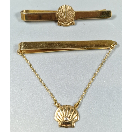 216 - Two 9ct gold Shell Ten Years Service tie pins. 18.3g approx. (B.P. 21% + VAT)