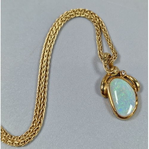 217 - 18ct gold necklace with opal pendant and inset tiny diamond chip. 9.4g approx. (B.P. 21% + VAT)