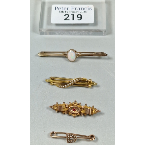 219 - Three 9ct gold Victorian and other bar brooches, one marked with the letter D, another inset with pe... 