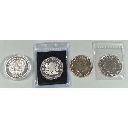 232 - Collection of four one 1 oz silver coins to include: Somali Republic African Wildlife Elephant, The ... 